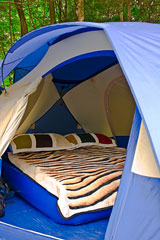 inflatable air bed in a camping tent